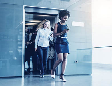Business people exiting the elevator