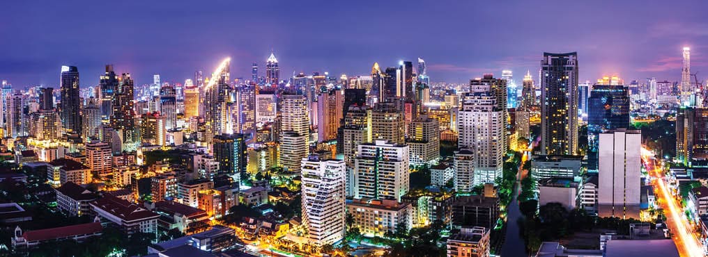 scenic of urban metropolis night cityscape on twilight skyline and speed light tail of car